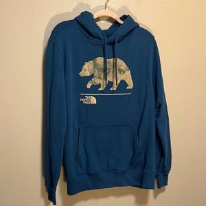 The North Face blue with tan bear graphic front
